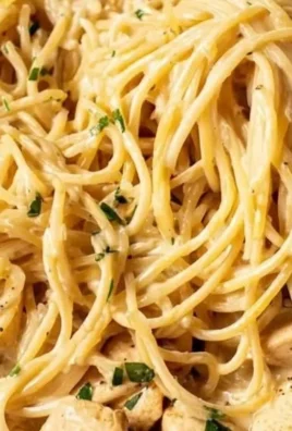 Delicious Easy Garlic Chicken Pasta served in a bowl with fresh herbs
