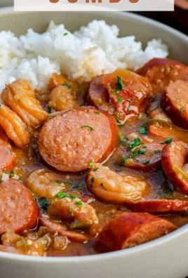 A bowl of delicious gumbo filled with shrimp, sausage, and vegetables