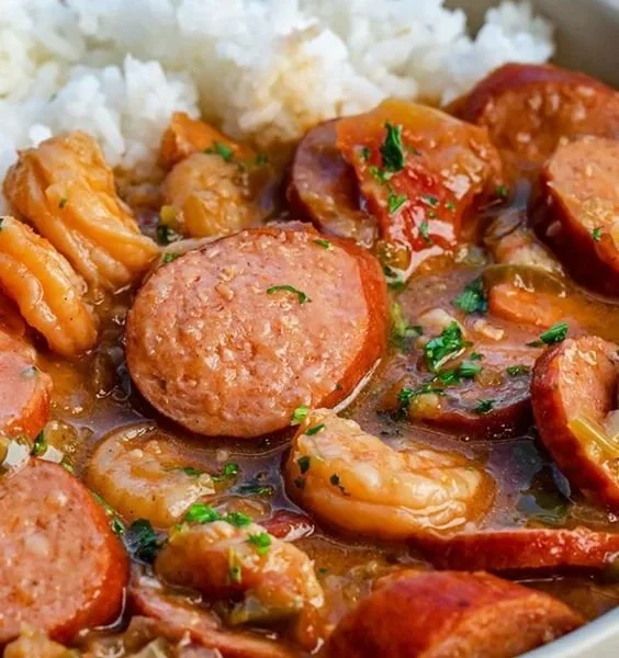 A bowl of delicious gumbo filled with shrimp, sausage, and vegetables