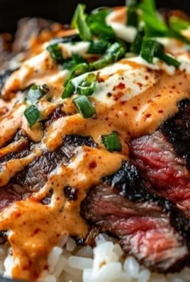 Korean BBQ Steak Rice Bowl with garnishes and colorful ingredients
