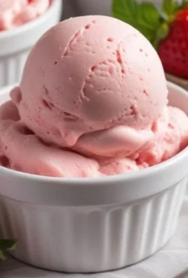 Bowl of quick and easy homemade strawberry ice cream topped with fresh strawberries