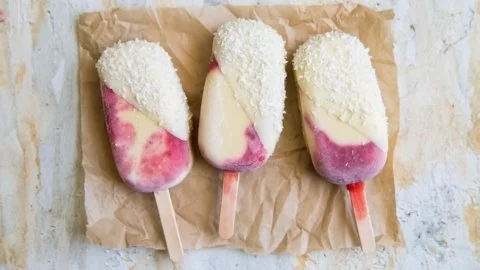 Delicious Raspberry Mango Coconut Pops with vibrant colors and tropical flavors.
