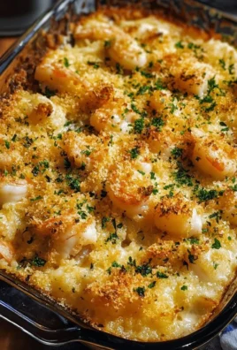 Delicious shrimp casserole served in a baking dish with cheese and breadcrumbs