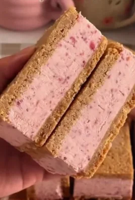 Homemade strawberry ice cream sandwiches on a plate