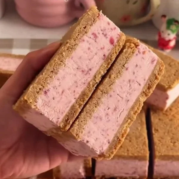 Homemade strawberry ice cream sandwiches on a plate