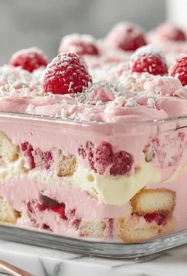 Delicious White Chocolate Raspberry Tiramisu dessert with fresh raspberries and layers.