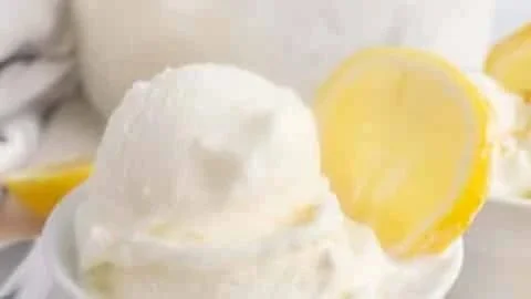 Delicious homemade lemon gelato served in a bowl with fresh lemons