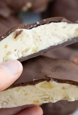 Chocolate covered peanut butter banana frozen yogurt bites on a plate