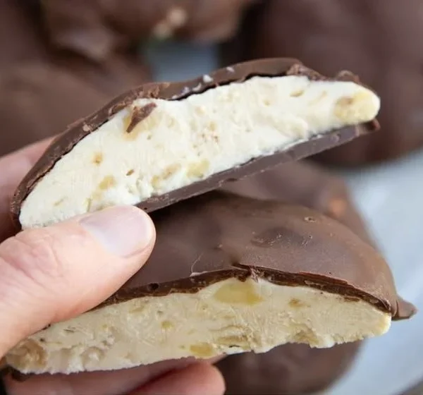 Chocolate covered peanut butter banana frozen yogurt bites on a plate