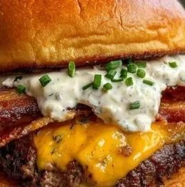Delicious loaded ranch bacon cheeseburger topped with fresh ingredients