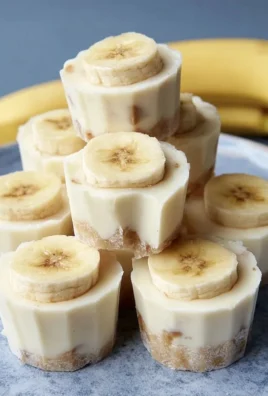 Delicious frozen banana yogurt bites arranged on a platter.
