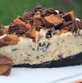 Delicious Frozen Reese's Pie garnished with chocolate and peanut butter