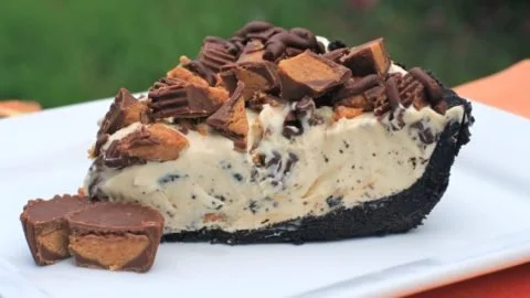 Delicious Frozen Reese's Pie garnished with chocolate and peanut butter