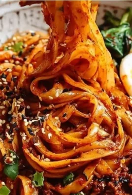 High protein spicy gochujang noodles dish with vibrant colors and toppings.