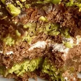 No Bake Dubai Chocolate Cake topped with chocolate and decorative sprinkles