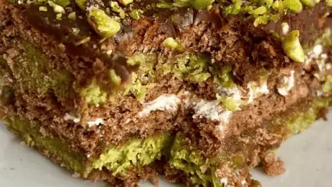 No Bake Dubai Chocolate Cake topped with chocolate and decorative sprinkles