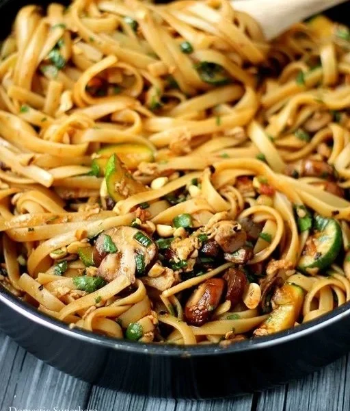 Delicious one pot spicy Thai noodles with vibrant colors and ingredients.