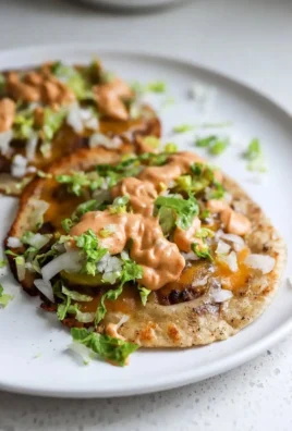 Delicious smash burger tacos with toppings and sauces