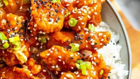 Air Fryer Orange Chicken served with rice and vegetables