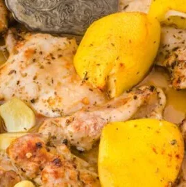 Baked lemon garlic chicken seasoned with Tuscany flavors on a plate.