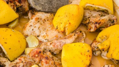 Baked lemon garlic chicken seasoned with Tuscany flavors on a plate.