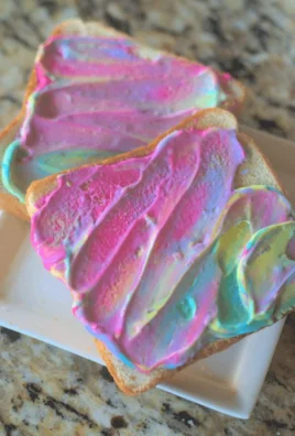 Colorful breakfast unicorn toast topped with vibrant fruit and natural ingredients.