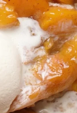 Freshly baked easy Southern peach cobbler in a rustic setting