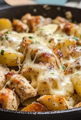 Garlic Parmesan Chicken and Potatoes Skillet dish served in a pan