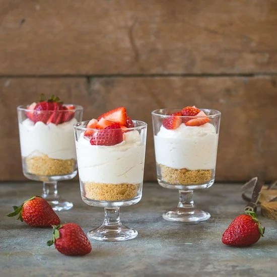 Individual no-bake cheesecake served in cups, creamy and delicious dessert