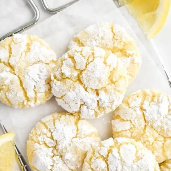 Freshly baked Lemon Crinkle Cookies dusted with powdered sugar