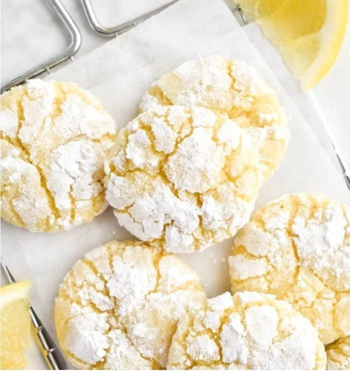 Freshly baked Lemon Crinkle Cookies dusted with powdered sugar