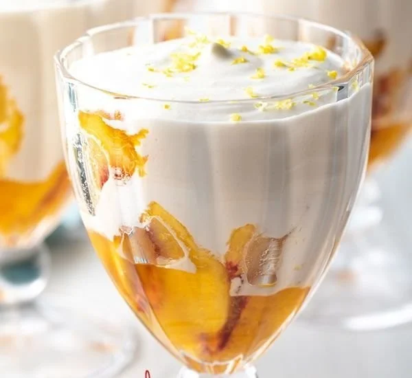 Delicious no-bake peaches and cream dessert with fresh peaches and whipped cream