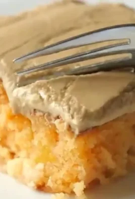 Delicious peach cake with brown sugar frosting on a decorative plate