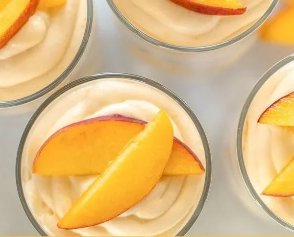 Delicious Summer Peach Mousse Trifles served in elegant glasses