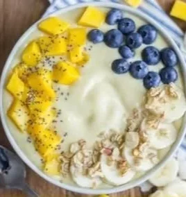 Delicious tropical breakfast smoothie with fruits in a glass