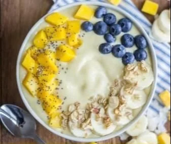 Delicious tropical breakfast smoothie with fruits in a glass